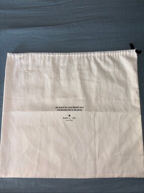 kate spade white drawstring duster pouch with printed logo